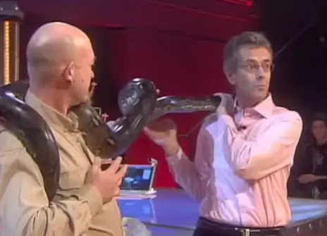 john Krebs and a man holding a snake around their necks