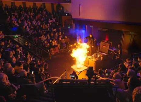 An explosive demo in the Ri Theatre during a lecture taking place