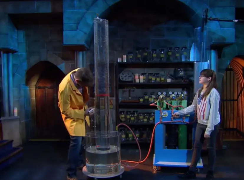 Peter Wother talking to a crowd of seated children during his CHRISTMAS LECTURE