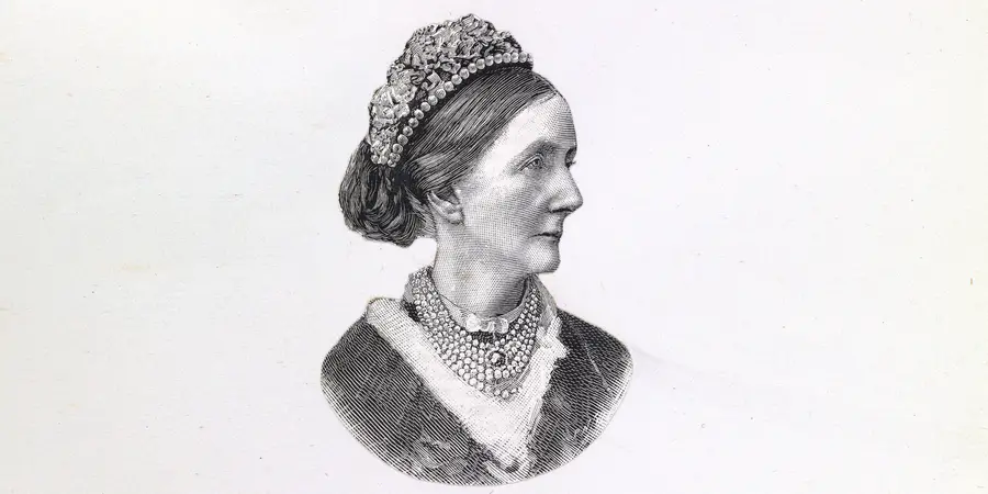 An etching of the side profile of Angela Burdett-Coutts, wearing a dark dress and pearl necklace with matching tiara