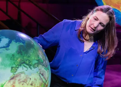 Helen Czerski with a giant light up globe