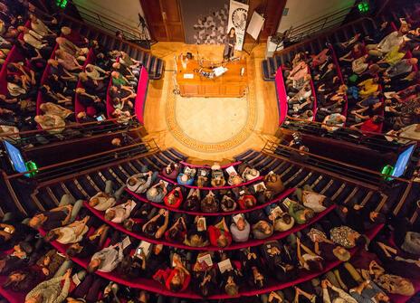 Birdseye image of a full theatre