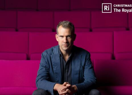  Chris Van Tulleken sitting in the Theatre at the Royal Institution