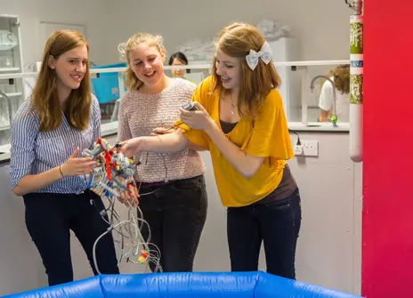 Students building electrical circuits
