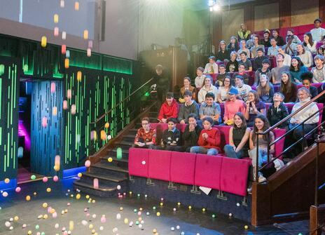 The 2019 Christmas lectures audience watch in the Theatre as the lecture begins