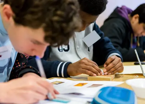 Students drawing shapes