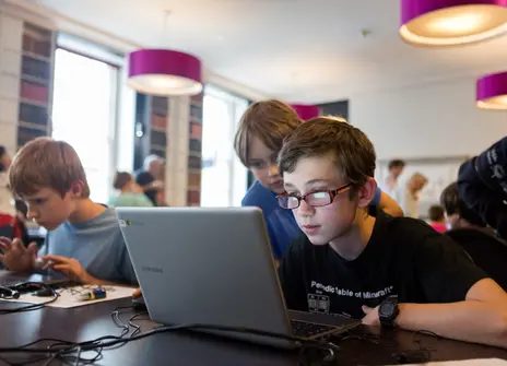 Students working on laptop computers