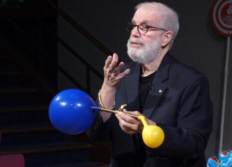 Jake experimenting with balloons at the Ri