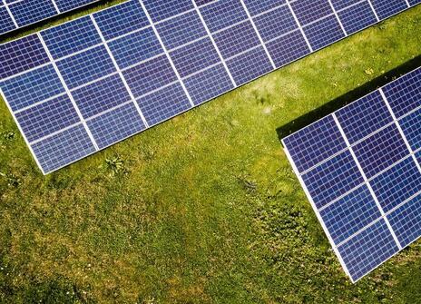 Solar panels in a green field