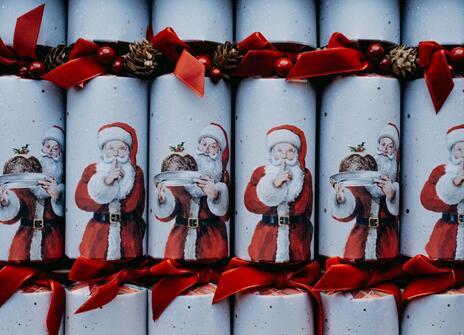 White christmas crackers with an image of Santa on each one